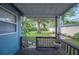 Backyard view featuring a covered deck and mature tree at 549 Palencia Pl, Lakeland, FL 33803