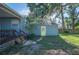 Backyard with a shed and a small porch with stairs at 549 Palencia Pl, Lakeland, FL 33803