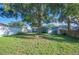 Backyard featuring a mature shade tree with fencing around property at 549 Palencia Pl, Lakeland, FL 33803