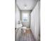 Cozy bathroom with white vanity and charming wood-look tile flooring at 549 Palencia Pl, Lakeland, FL 33803