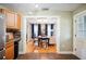 Open dining area offers a glimpse into the adjacent kitchen, promoting a modern and fluid living space at 549 Palencia Pl, Lakeland, FL 33803