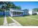 Charming single Gathering home with a well-manicured lawn and vibrant landscaping, enhancing its curb appeal at 549 Palencia Pl, Lakeland, FL 33803