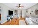 Comfortable living room featuring gleaming hardwood floors, neutral paint, and an inviting cozy atmosphere at 549 Palencia Pl, Lakeland, FL 33803