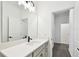 Modern bathroom featuring sleek black hardware and quartz countertops at 6068 Sacred Oak Ave, Mount Dora, FL 32757