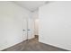 Carpeted bedroom with black hardware and ample closet space at 6068 Sacred Oak Ave, Mount Dora, FL 32757