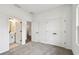 Bedroom with ensuite bathroom, closet, and neutral colored carpet at 6068 Sacred Oak Ave, Mount Dora, FL 32757