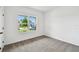 Bright bedroom with a large window that offers lots of natural light at 6068 Sacred Oak Ave, Mount Dora, FL 32757