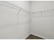 Walk-in closet with wire shelving and wood-look flooring at 6068 Sacred Oak Ave, Mount Dora, FL 32757