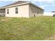 Lush backyard with ample green space, perfect for recreation and relaxation at 887 Galloway St, Lake Alfred, FL 33850