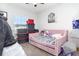 This is a simply designed bedroom with a daybed, lots of storage and a lion picture at 887 Galloway St, Lake Alfred, FL 33850