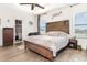 This is a spacious main bedroom with natural light, closet storage and wood flooring at 887 Galloway St, Lake Alfred, FL 33850