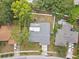Directly above a home, showing the roof, white fence, and surrounding yard with mature trees at 446 Eagle Cir, Casselberry, FL 32707