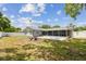 Expansive backyard showcasing a screened-in patio, patio, and privacy fence at 446 Eagle Cir, Casselberry, FL 32707