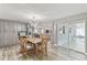 Dining area with a table set for four and ample natural light with an open concept to kitchen at 446 Eagle Cir, Casselberry, FL 32707