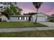 Charming single-story home with a well-manicured lawn and a two-car garage at 446 Eagle Cir, Casselberry, FL 32707