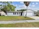 Charming single-story home with a well-manicured lawn and a two-car garage at 446 Eagle Cir, Casselberry, FL 32707