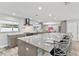 Bright kitchen with a spacious island, modern appliances, and stylish bar stool seating at 446 Eagle Cir, Casselberry, FL 32707