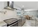 Modern kitchen with granite countertops, stainless steel appliances, and an open layout at 446 Eagle Cir, Casselberry, FL 32707