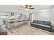 Spacious kitchen with a large island and seating that flows into the living room at 446 Eagle Cir, Casselberry, FL 32707