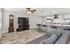 Bright and open living space with a view to the kitchen island with barstool seating at 446 Eagle Cir, Casselberry, FL 32707