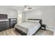 Main bedroom with neutral walls, ceiling fan, and dark furniture at 446 Eagle Cir, Casselberry, FL 32707