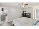 Main bedroom featuring neutral walls, light flooring, a ceiling fan, and ensuite access at 446 Eagle Cir, Casselberry, FL 32707