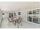 Relaxing covered patio with a table and chairs perfect for outdoor dining at 446 Eagle Cir, Casselberry, FL 32707