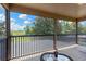 The screened-in balcony overlooks the tennis court, perfect for a relaxing afternoon at 886 Suffolk Pl, Davenport, FL 33896