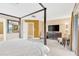 Spacious bedroom boasts a king bed, ensuite bathroom, and balcony access at 886 Suffolk Pl, Davenport, FL 33896