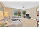 Comfortable living room with a large sectional sofa and sliding glass doors leading to the outdoor pool area at 886 Suffolk Pl, Davenport, FL 33896