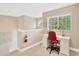 Upstairs landing area serving as office with desk and chair, natural light streaming in, and a cozy workspace at 886 Suffolk Pl, Davenport, FL 33896