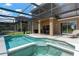 A beautiful screened-in pool and patio area offers a relaxing outdoor space with a dining set and chair at 886 Suffolk Pl, Davenport, FL 33896