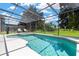 The sparkling pool and spa offer a refreshing escape, set against a backdrop of lush landscaping at 886 Suffolk Pl, Davenport, FL 33896