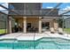 Relax by the pool on the expansive lanai, perfect for gatherings and enjoying the beautiful Florida weather at 886 Suffolk Pl, Davenport, FL 33896