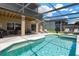 The lanai features a sparkling pool and spa, along with ample space for outdoor dining and lounging at 886 Suffolk Pl, Davenport, FL 33896