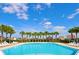 Community swimming pool with rows of palm trees and lounge chairs create a relaxing resort-style atmosphere at 886 Suffolk Pl, Davenport, FL 33896