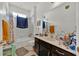 Bathroom featuring a vanity and shower-tub combination at 890 Marisa Ln, Kissimmee, FL 34744