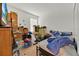 Bedroom with carpeting and filled with boxes and furniture at 890 Marisa Ln, Kissimmee, FL 34744