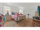 Bedroom featuring carpet, white walls and a metal bed frame at 890 Marisa Ln, Kissimmee, FL 34744