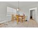 Eat-in dining room with tiled flooring, a window, and a wooden table with chairs at 890 Marisa Ln, Kissimmee, FL 34744