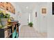 Bright entryway featuring neutral tile flooring, white walls and view of the front door at 890 Marisa Ln, Kissimmee, FL 34744