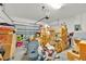 Cluttered two-car garage space with the door closed at 890 Marisa Ln, Kissimmee, FL 34744