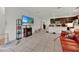 Bright living room with tiled floors and an open layout leading to the kitchen at 890 Marisa Ln, Kissimmee, FL 34744
