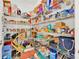 Walk-in pantry featuring wire shelving and abundant storage space at 890 Marisa Ln, Kissimmee, FL 34744
