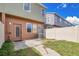 Enclosed backyard with privacy fence, some green space, and back door access to the home at 12975 Calderdale Ave, Windermere, FL 34786