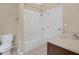 Well-lit bathroom with white tub, shower, and vanity at 12975 Calderdale Ave, Windermere, FL 34786