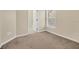 Bedroom featuring neutral walls, carpeted floors, and an ensuite bathroom at 12975 Calderdale Ave, Windermere, FL 34786