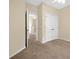 Bedroom with neutral walls, carpeted floors, and a closet with double doors at 12975 Calderdale Ave, Windermere, FL 34786
