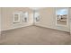Spacious bedroom with carpet flooring, neutral walls, and abundant natural light at 12975 Calderdale Ave, Windermere, FL 34786