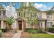 Charming two-story townhome with a cozy front porch and well-maintained landscaping at 12975 Calderdale Ave, Windermere, FL 34786